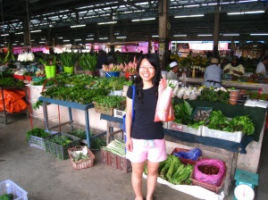 Happy posing in front of the pasar