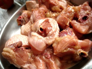 Marinating the chicken pieces.